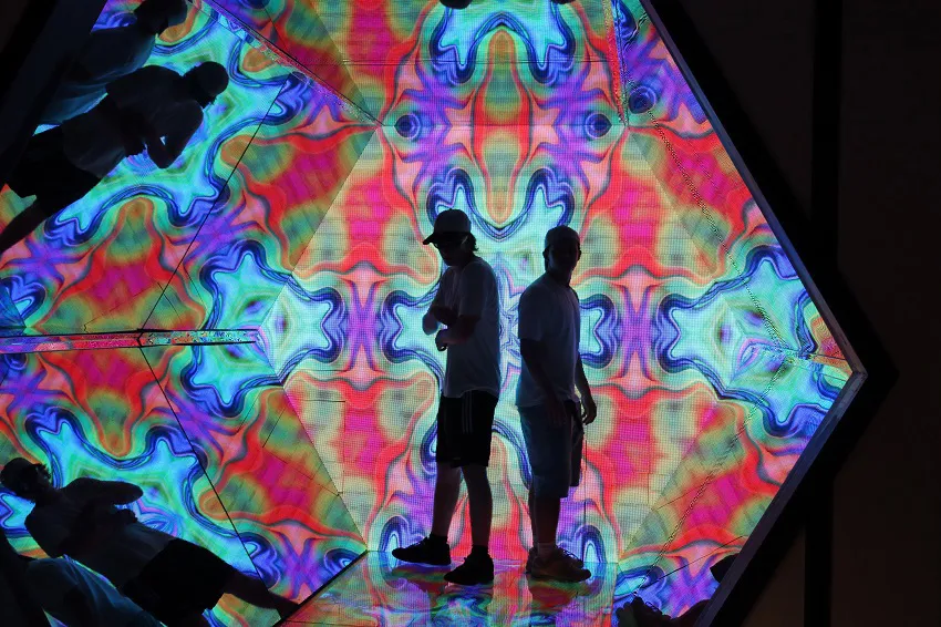 Maths students in an optical illusion at the Paradox Museum